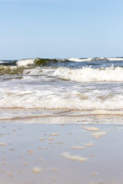 High and dangerous waves on the beach of Zempin on the island of Usedom on a beautiful day in summer