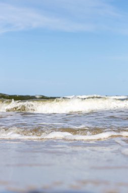 High and dangerous waves on the beach of Zempin on the island of Usedom on a beautiful day in summer