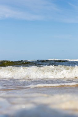 High and dangerous waves on the beach of Zempin on the island of Usedom on a beautiful day in summer