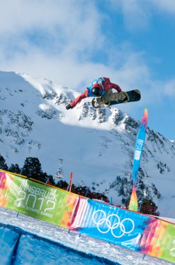 KUEHTAI, AUSTRIA - JANUARY 14: YOG2012, Youth Olympic Games Innsbruck 2012, SNOWBOARD Halfpipe, Men. Rider: Ben Ferguson from USA clipart