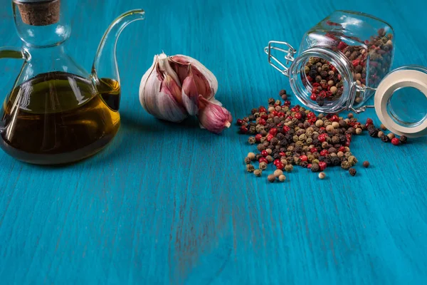 Blue Wooden Background Oil Can Head Garlic Pot Peppercorns Copy — Fotografia de Stock