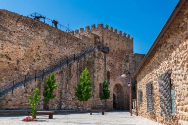 Stairs to climb the high wall, of medieval origin, next to the Plaza de los Caidos, in Buitrago de Lozoya