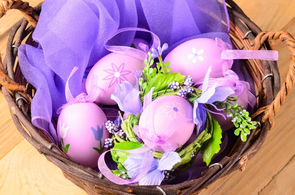 Easter decorative eggs in the basket — Stock Photo, Image