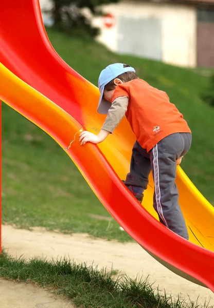 Boy on the big slides — Stock Photo, Image