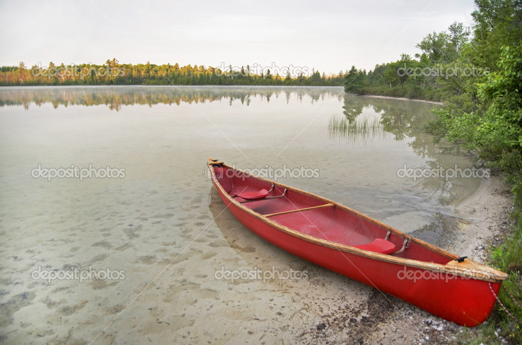Red Canoe On Lake