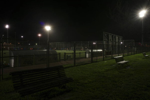 Urban park in a winter evening