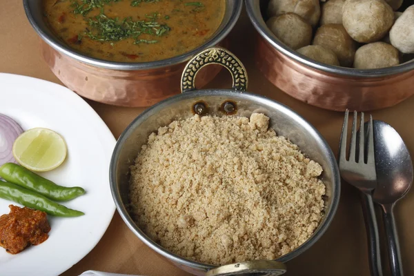 Churma adalah makanan lezat yang populer yang disajikan dengan baatis dan dal — Stok Foto