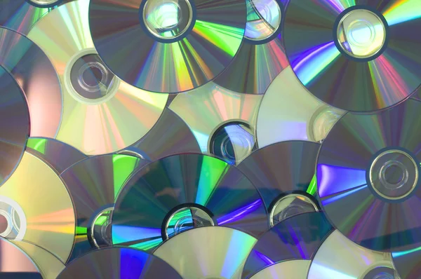 Piled of shiny yellow DVD disc — Stock Photo, Image