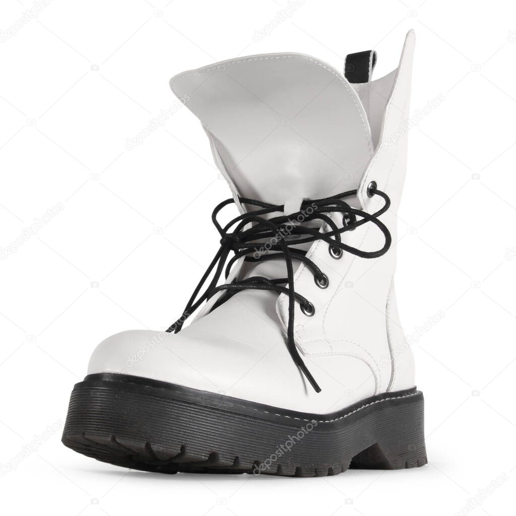 woman`s white leather boots on a light background