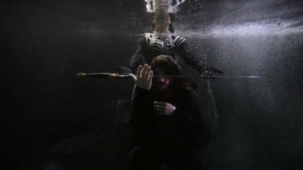 Mysterious woman is giving magic sword to man floating underwater, medieval fairytale of hero knight — Vídeo de Stock