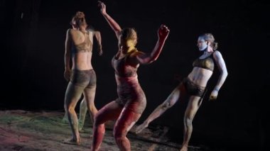 improvisation in dance class, young ladies in paints are training modern choreography