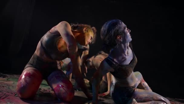 Choreographic sketch, modern dance performance with paints, four young women are dancing together — Video