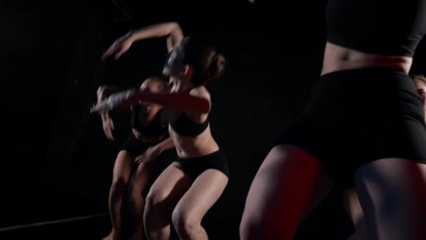 Contemporary dance of team of young female dancers in studio, ladies are rehearsing movements — Stockvideo