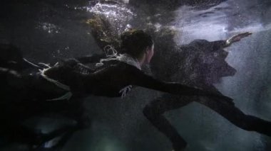 romantic date of medieval princess and knight inside water of sea, man and woman are floating