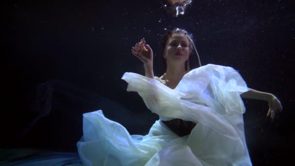 Princess of underwater kingdom on bottom of magical sea or ocean, romantic fairytale shot — стоковое видео