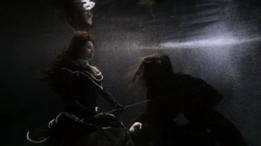 scene from medieval Europe underwater, magic and fairytale concept, queen is knighting man