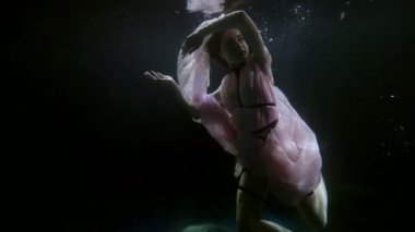 seductive and sensual female figure inside water of pool or magical lake, sexy lady underwater