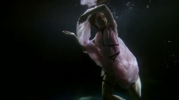 Seductive and sensual female figure inside water of pool or magical lake, sexy lady underwater — Stock video