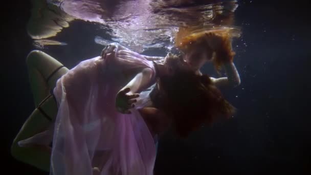 Couple of alluring young women is floating underwater, romantic shot, lesbians girlfriends — Stock video