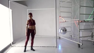 dance rehearsing of young sexy woman in studio, lady is dancing alone