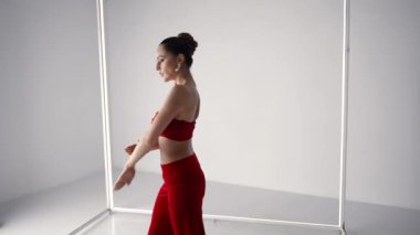 sexy lady is dancing in studio alone, extravagant dance, modern choreography