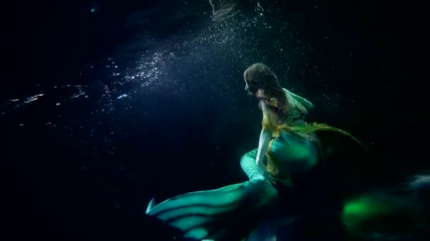 Mysterious underwater world, magical mermaid is floating in depth, art and fantasy shot — Stock Video