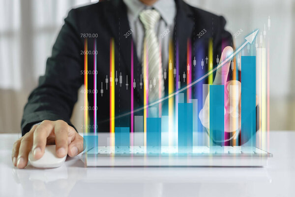 Businessman index finger trading graph using computer keyboard. stock exchange marketing analyzing chart. information statistics diagram profit. investment and marketing concept. 