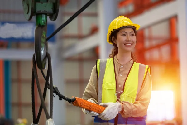 woman engineer technical department working in power plant control panel of industry factory. female professional system electrician machine control.