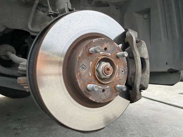 close up car brake disc, automobile service mechanic repair transportation.