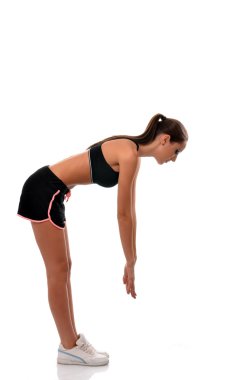 spory kadının egzersiz yapması için parmaklarını ulaşan