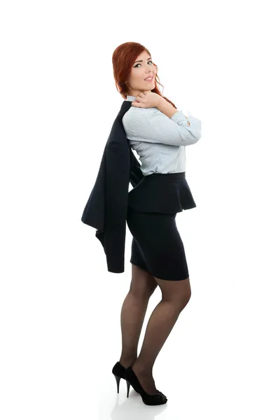 Successful business woman with coat over her shoulder — Stock Photo, Image