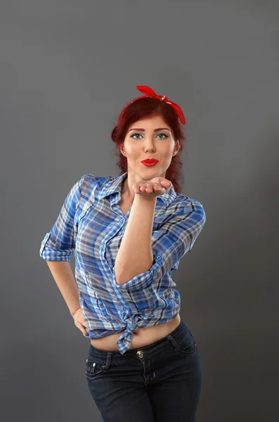 Pin up girl blowing a kiss Stock Photo