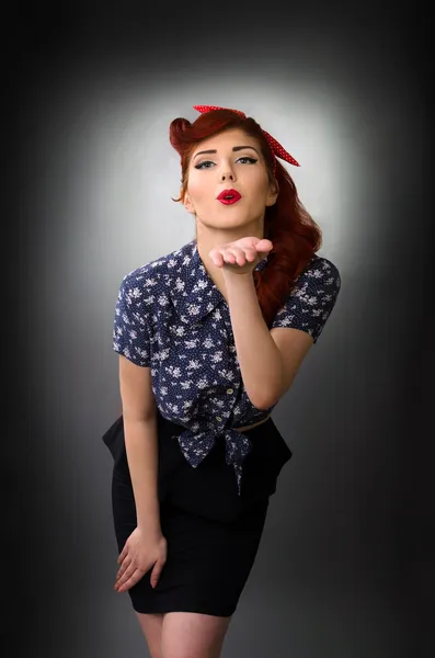 Pin up girl blowing a kiss — Stock Photo, Image