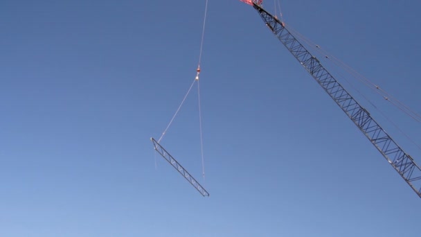 Tight shot of steel beam being lifted. — Stock Video