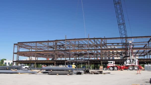 Wide shot of steel beam being lifted. — Stock Video