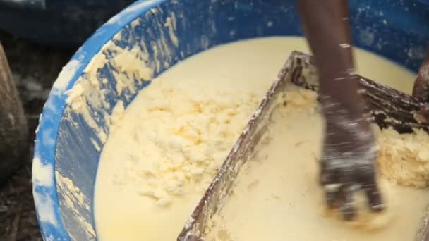 Pressing cassava through screen. — Stock Video