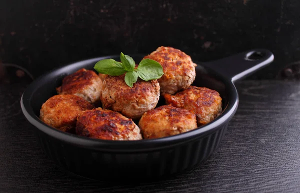 Meat Cutlets Decorated Basil Black Frying Pan Black Background — Stock Photo, Image