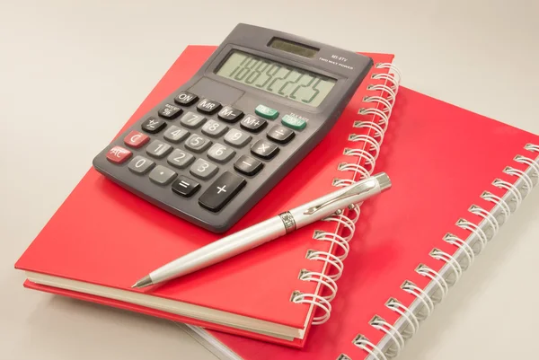 Pen, calculator and notebooks — Stock Photo, Image