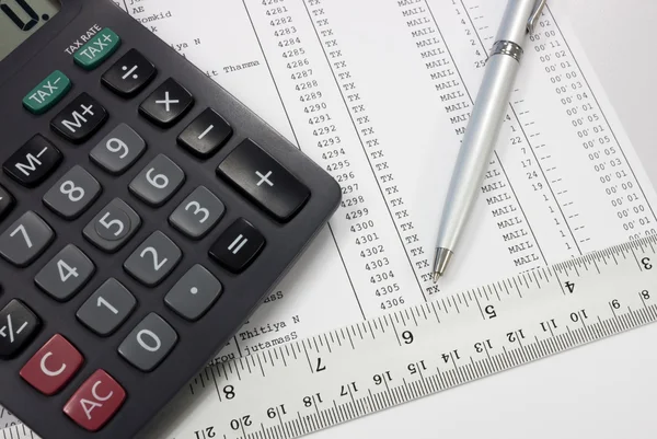 Calculator pen ruler on document — Stock Photo, Image