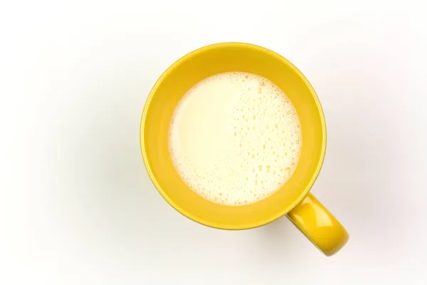 Žlutý Pohár Mléka Izolované Bílém Pozadí Horní Pohled — Stock fotografie
