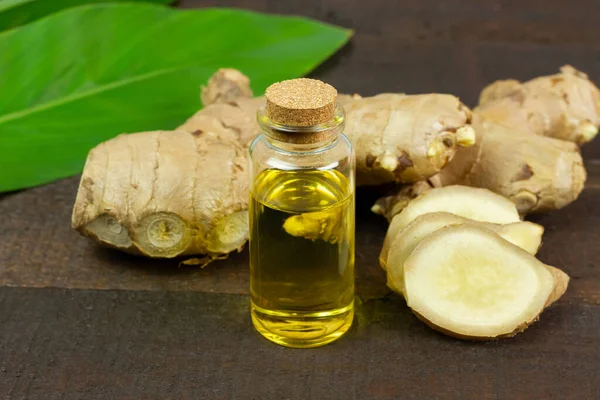 Ginger Essential Oil Bottle Fresh Ginger Rustic Wooden Background Scientific — Stock Photo, Image