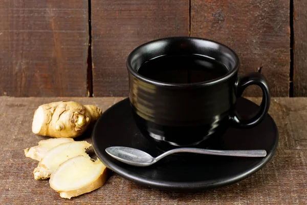 Ginger Tea Black Cup Sliced Fresh Ginger Wooden Background Scientific — Stock Photo, Image