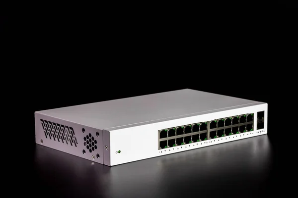 24-port gigabit switch white color isolated on black background. Components to create local area network for share data and device.