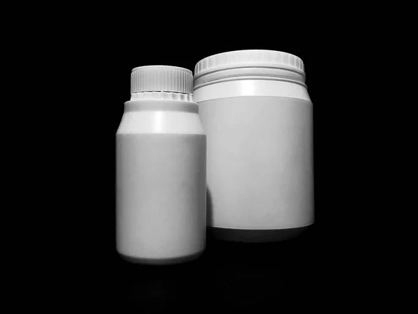 Empty Plastic White Bottles Dark Background — Stock Fotó