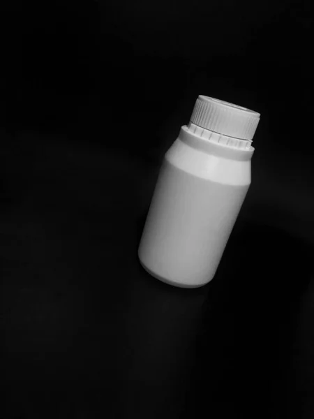 Empty Plastic White Bottle Dark Background — Stock Fotó