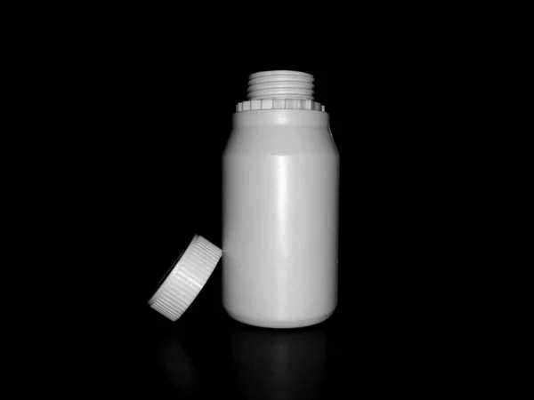 Empty Plastic White Bottle Dark Background — ストック写真