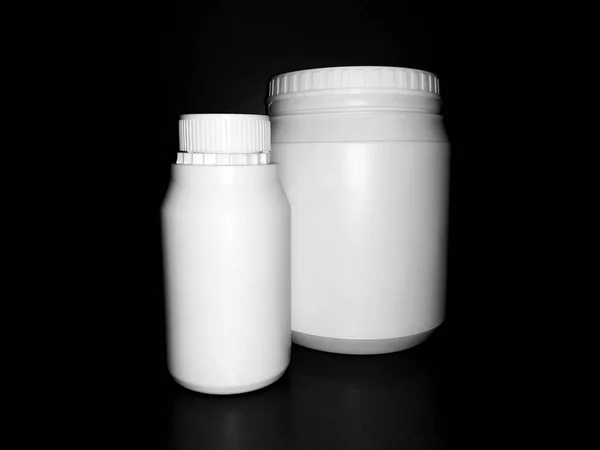 Empty Plastic White Bottles Dark Background — Stock Fotó