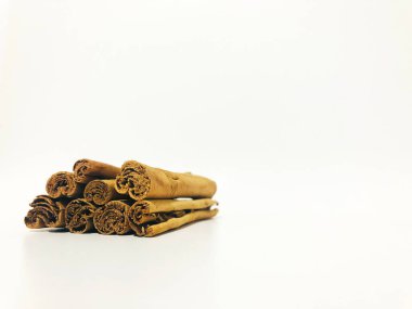Fragrant cinnamon sticks on a white background