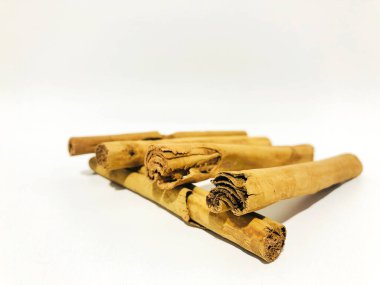 Fragrant cinnamon sticks on a white background