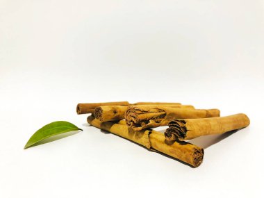 Fragrant cinnamon sticks on a white background